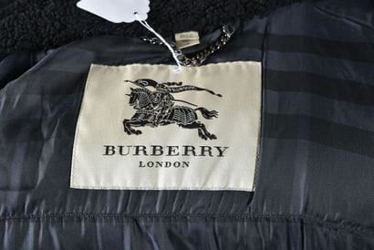 BURBERRY. Blue quilted jacket with black...