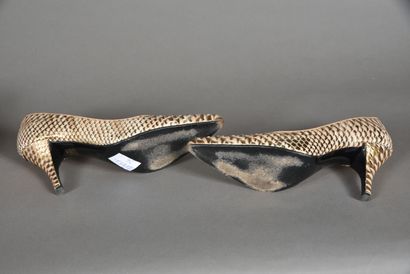 CHARLES JOURDAN. Pair of copper pumps, reptile...
