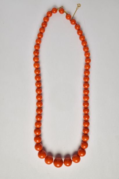 Necklace of coral pearls in fall (diameters:...