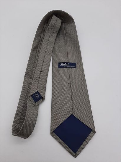 CHANEL. Blue silk tie with yellow polo mesh...