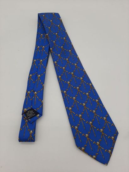 CHANEL. Blue silk tie with yellow polo mesh...