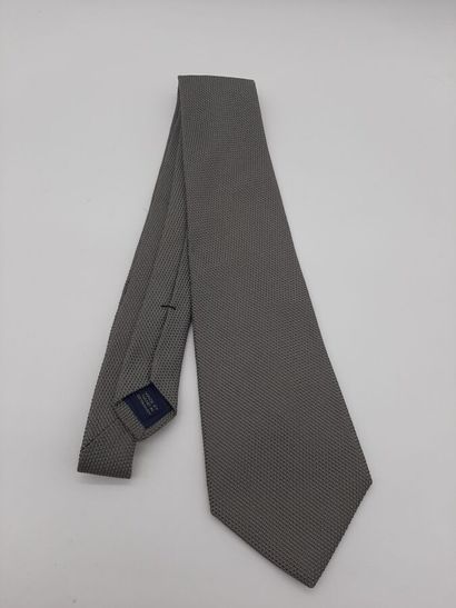 CHANEL. Blue silk tie with yellow polo mesh...