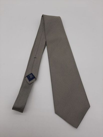 CHANEL. Blue silk tie with yellow polo mesh...