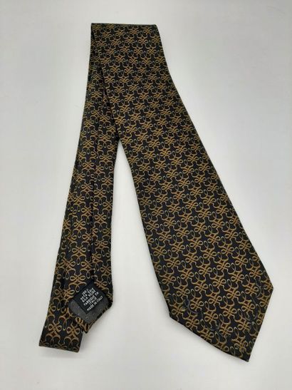 CHANEL. Blue silk tie with yellow polo mesh...