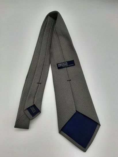 CHANEL. Blue silk tie with yellow polo mesh...