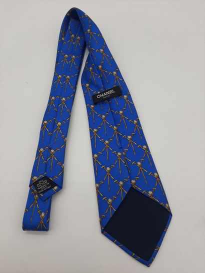 CHANEL. Blue silk tie with yellow polo mesh...