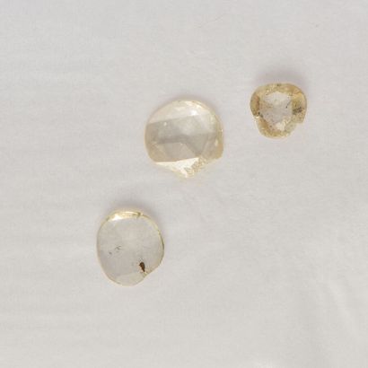 Lot comprising three rose-cut diamonds weighing...