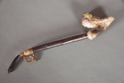 Pipe in terra cotta representing a head of...
