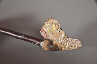 Pipe in terra cotta representing a head of...