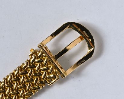 HERMÈS: Belt bracelet in 18K (750/oo) yellow...