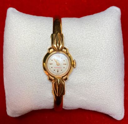 CAUNY: Gold-plated metal wristwatch, round...
