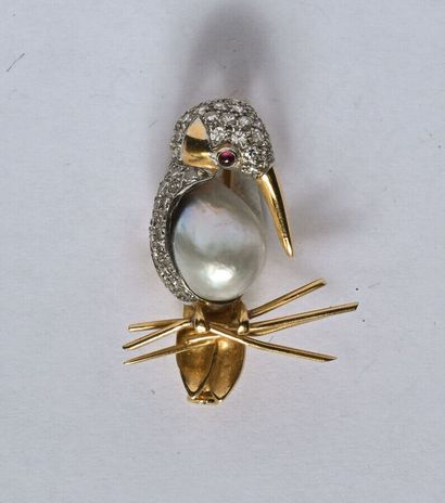 Broche en or 18K (750/oo) et platine (850/oo)...