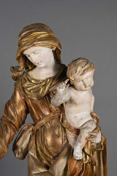 Vierge à l'enfant en bois sculpté polychromé...