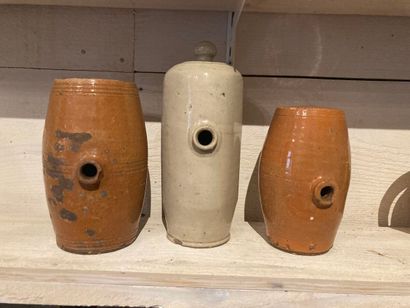 Three spirit barrels, two in orange glazed...