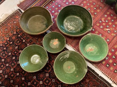 SAVOIE. Six green glazed earthenware tians.
20th...