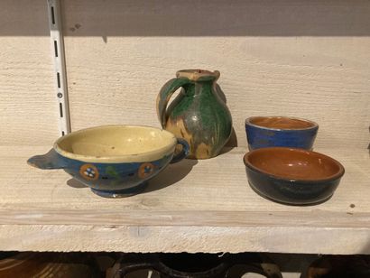 Set of four glazed earthenware pots with...