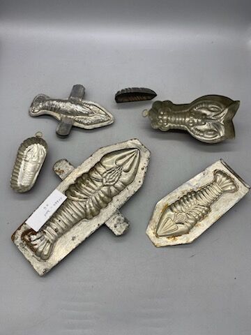 Six lobster-shaped tin or copper chocolate...