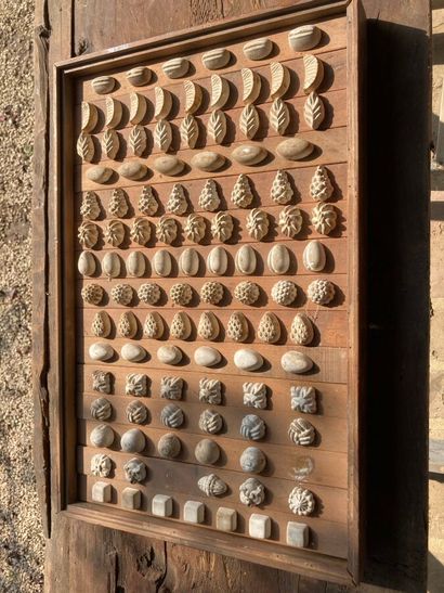 Plaster candy molds featuring flowers, pomegranates,...