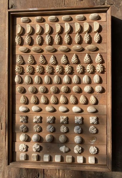 Plaster candy molds featuring flowers, pomegranates,...