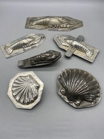 Six tin molds, shell, crayfish, lobster.
20th...