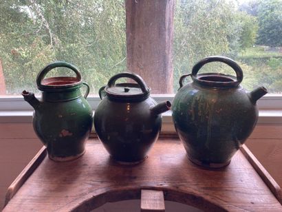 DAUPHINÉ? Three piriform jugs in green glazed...