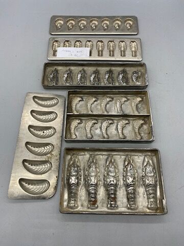 Eleven tinplate and metal chocolate mold...