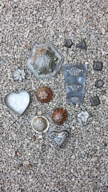 Fourteen iron or copper chocolate molds in...