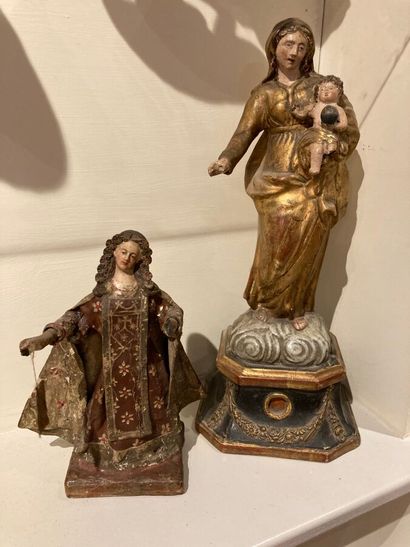 Two statuettes in cardboard or papier-mache...