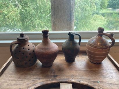 Three glazed earthenware jugs. 
A rare egg-shaped...