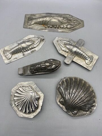 Six tin molds, shell, crayfish, lobster.
20th...