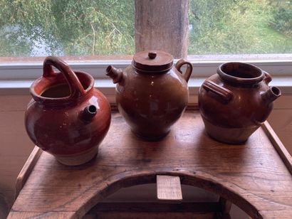 Three orange and beige glazed earthenware...