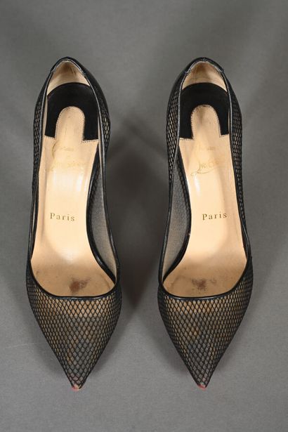 LOUBOUTIN. Pair of black fishnet pumps with...