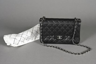 CHANEL. Black quilted caviar leather Timeless...