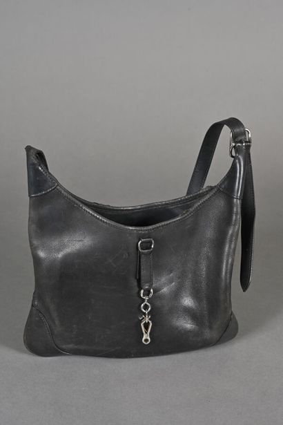 ANONYMOUS. Black leather bag in the spirit...