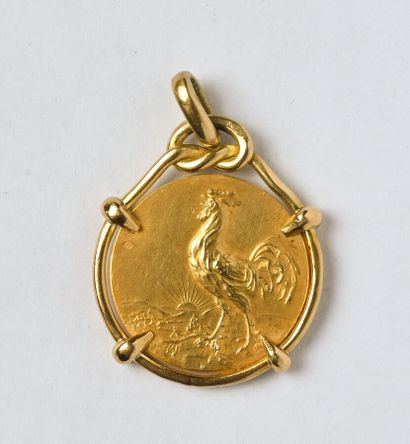 Médaille en or jaune 18K (750/oo) marquée...