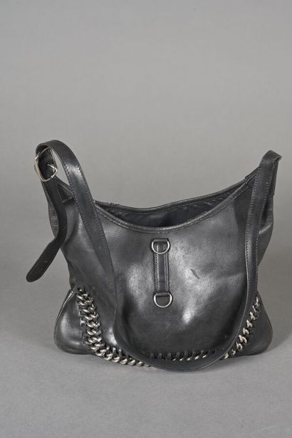 ANONYMOUS. Black leather bag in the spirit...