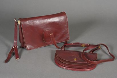MUST BY CARTIER. Burgundy leather half-moon...