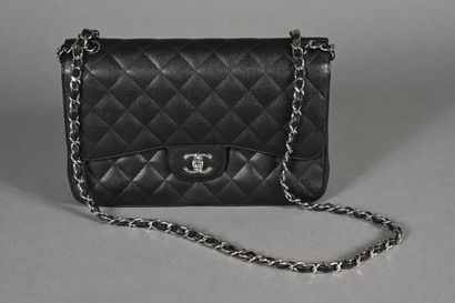 CHANEL. Black quilted caviar leather Timeless...