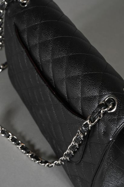CHANEL. Black quilted caviar leather Timeless...