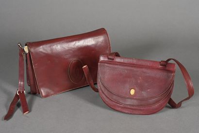 MUST BY CARTIER. Burgundy leather half-moon...