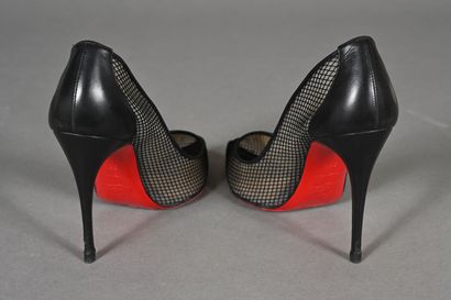 LOUBOUTIN. Pair of black fishnet pumps with...
