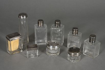 Toilet set comprising eight cut-crystal bottles...
