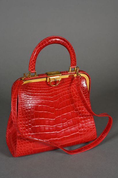DIOR. Clasp bag in red crocodile-style leather,...