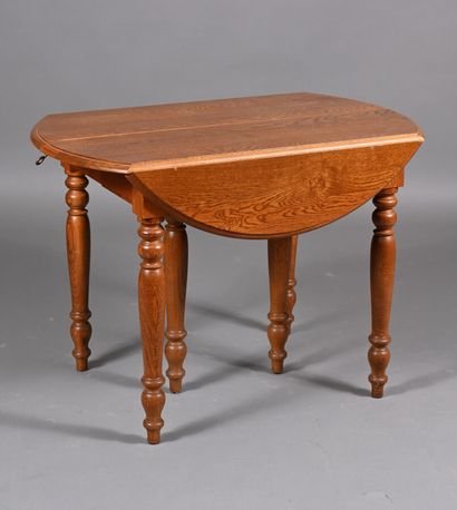 Table en bois mouluré et tourné à deux volets...