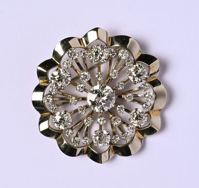 Broche ronde en or gris 18K (750/oo) et platine...