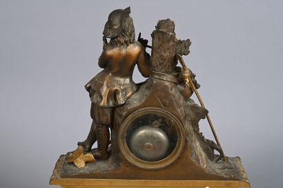 Pendule en bronze doré et patiné figurant...