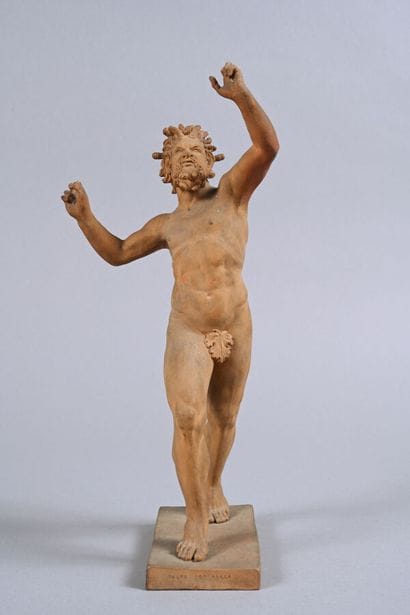 Statue en terre-cuite figurant un faune dansant...