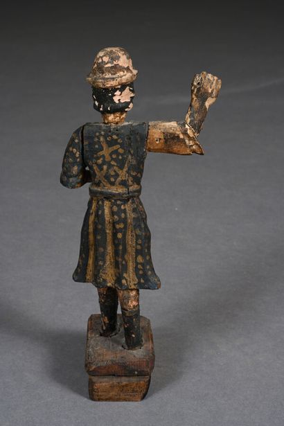 Personnage en bois sculpté figurant un homme...