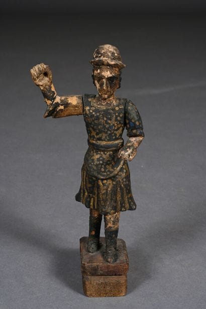 Personnage en bois sculpté figurant un homme...