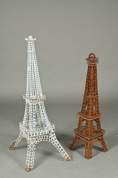 Two decorative Eiffel Towers, one in metal,...